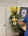 A man holds an extra large gold custom engraved trophy award cup.